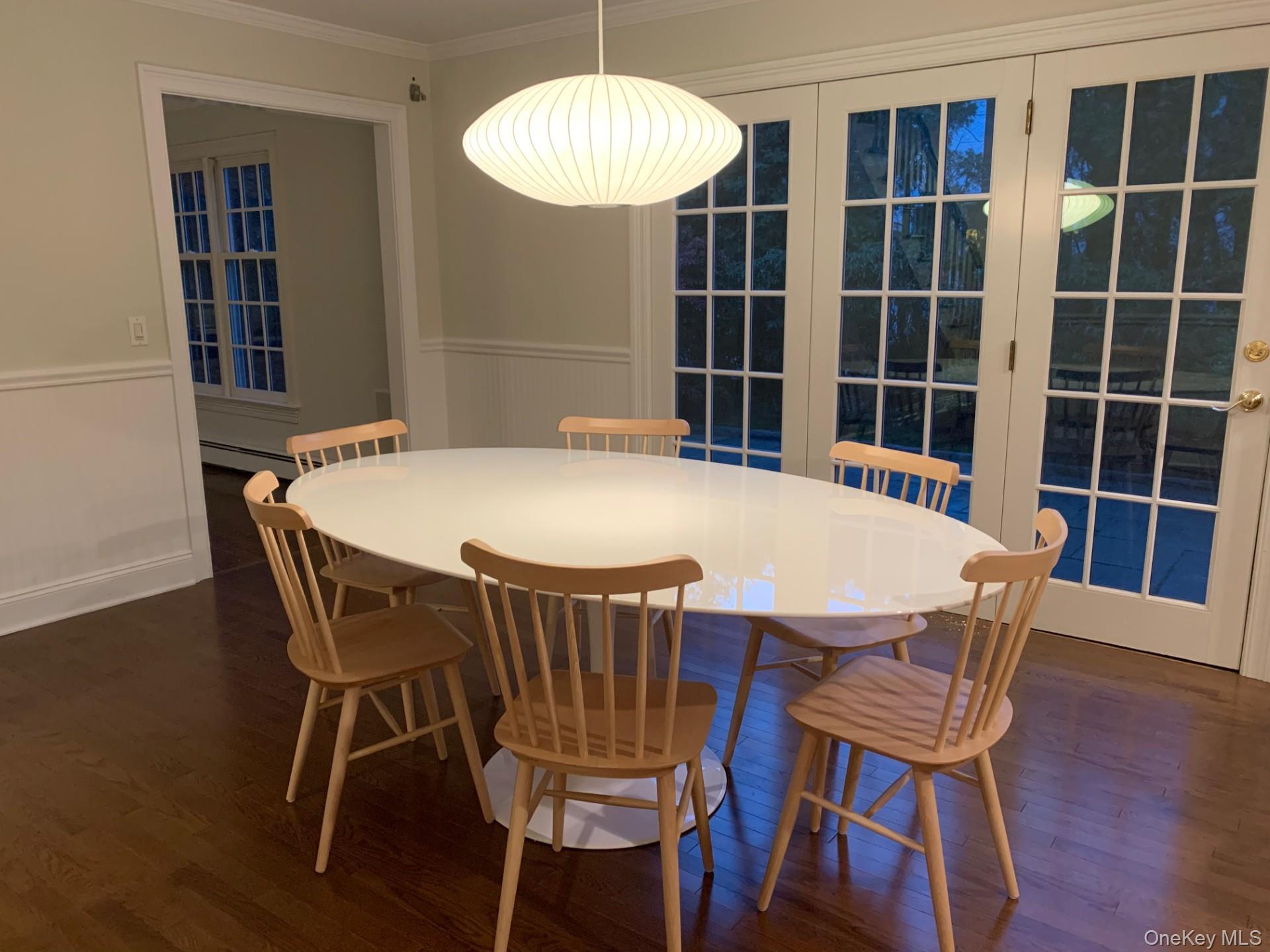 21 Westbank Road Rye, NY 10580 - Photo 7 of 32 a view of a dining room with furniture and wooden floor