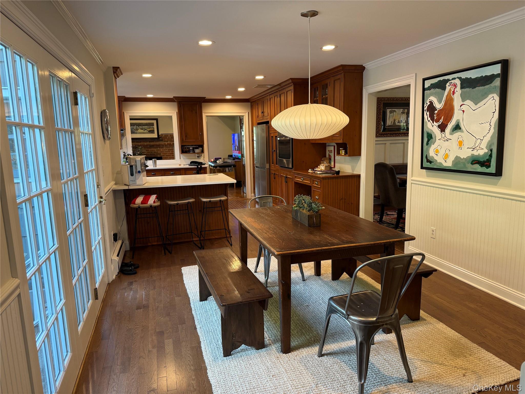 21 Westbank Road Rye, NY 10580 - Photo 8 of 32 a kitchen with a table chairs sink and wooden floor