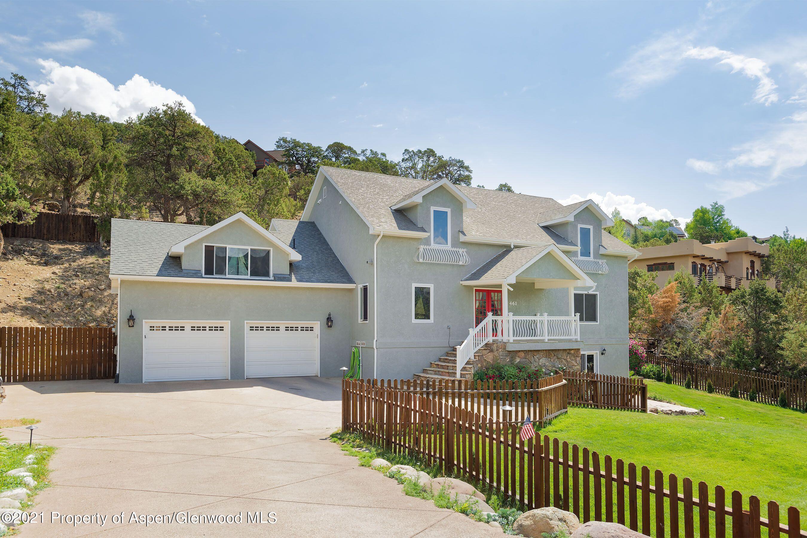 461 Original Road Basalt, CO 81621 - Photo 1 of 23 a front view of a house with a yard and garage