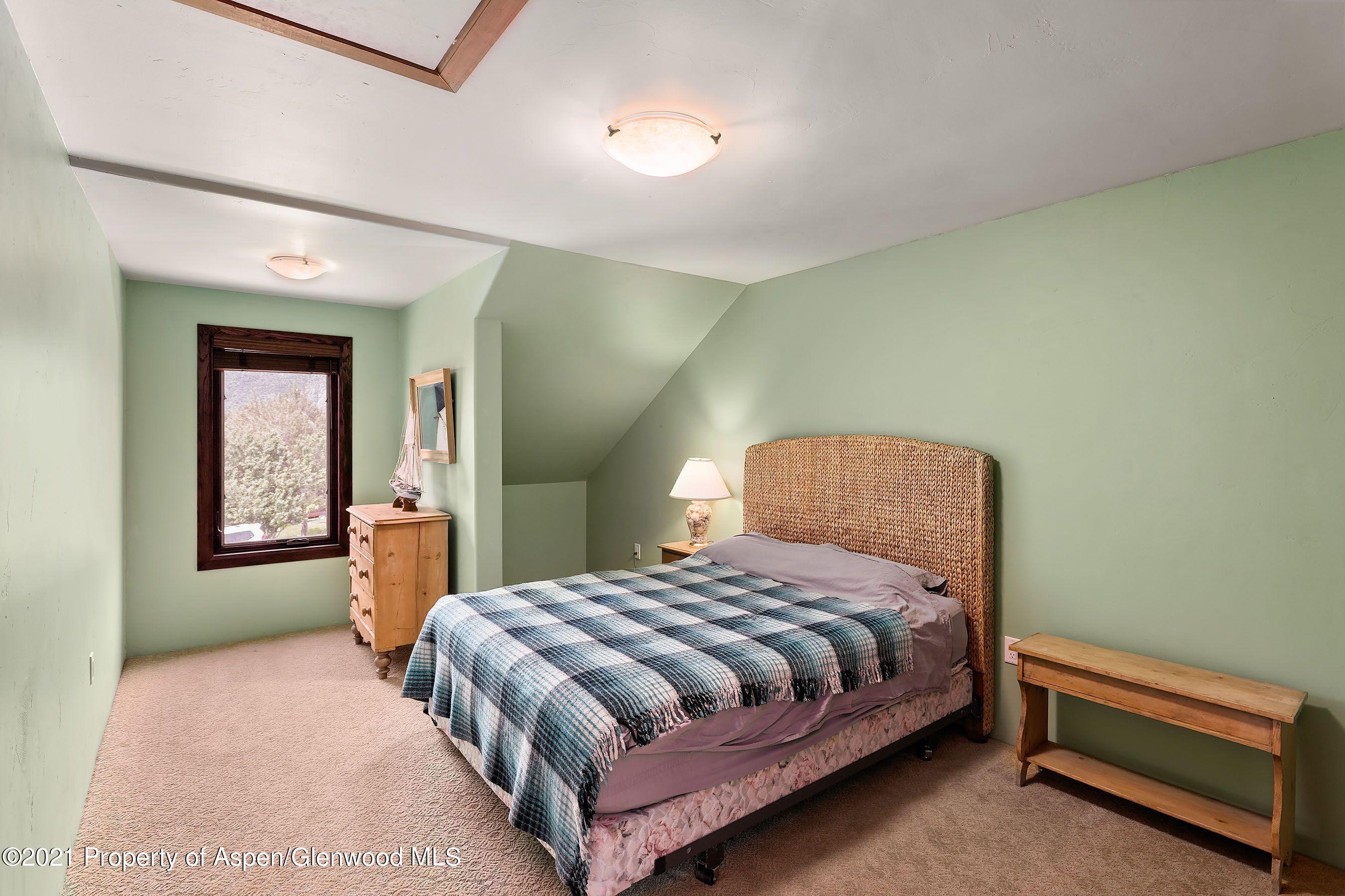 461 Original Road Basalt, CO 81621 - Photo 14 of 23 a bedroom with a bed and a night lamp