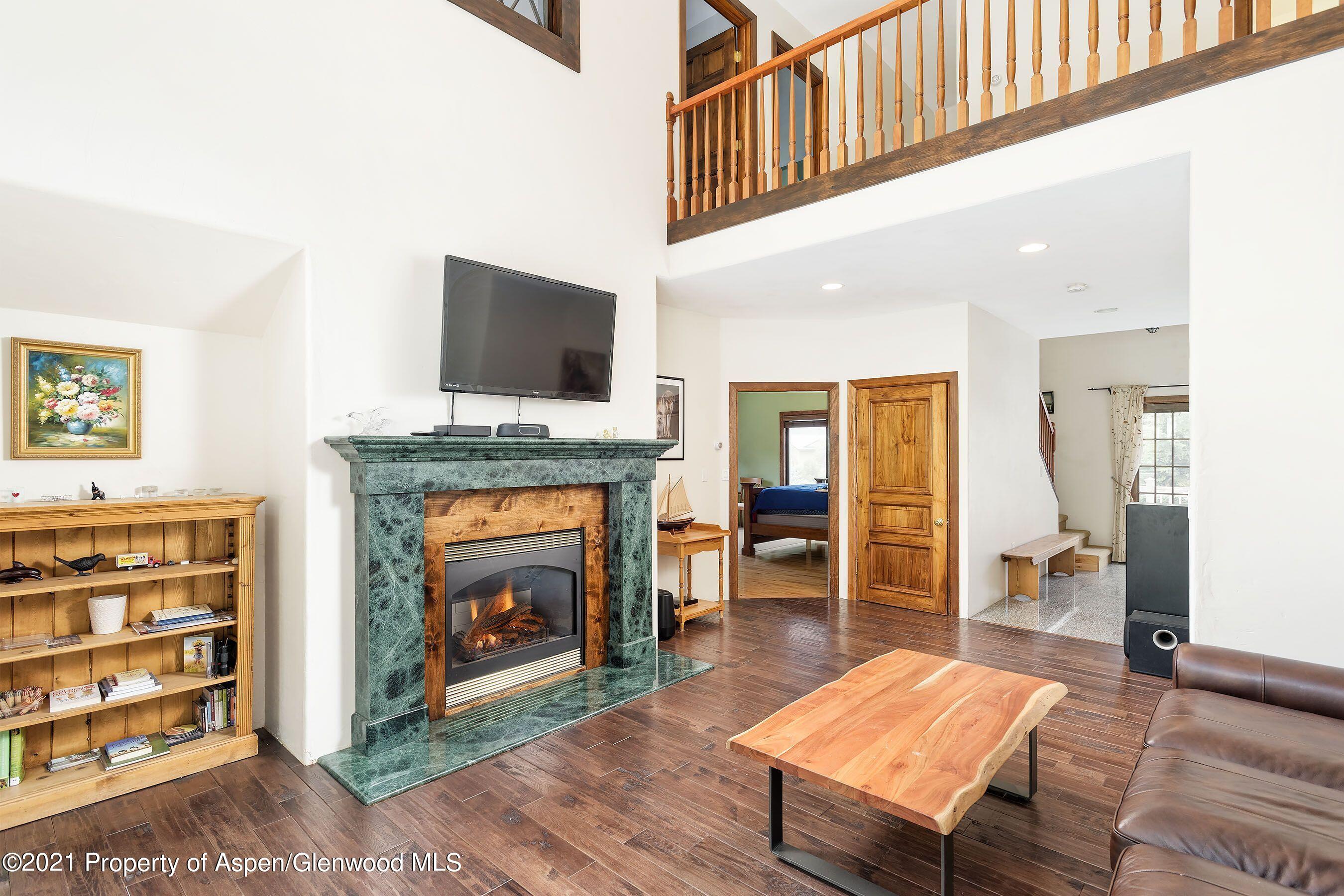 461 Original Road Basalt, CO 81621 - Photo 21 of 23 a living room with furniture a fireplace and a flat screen tv