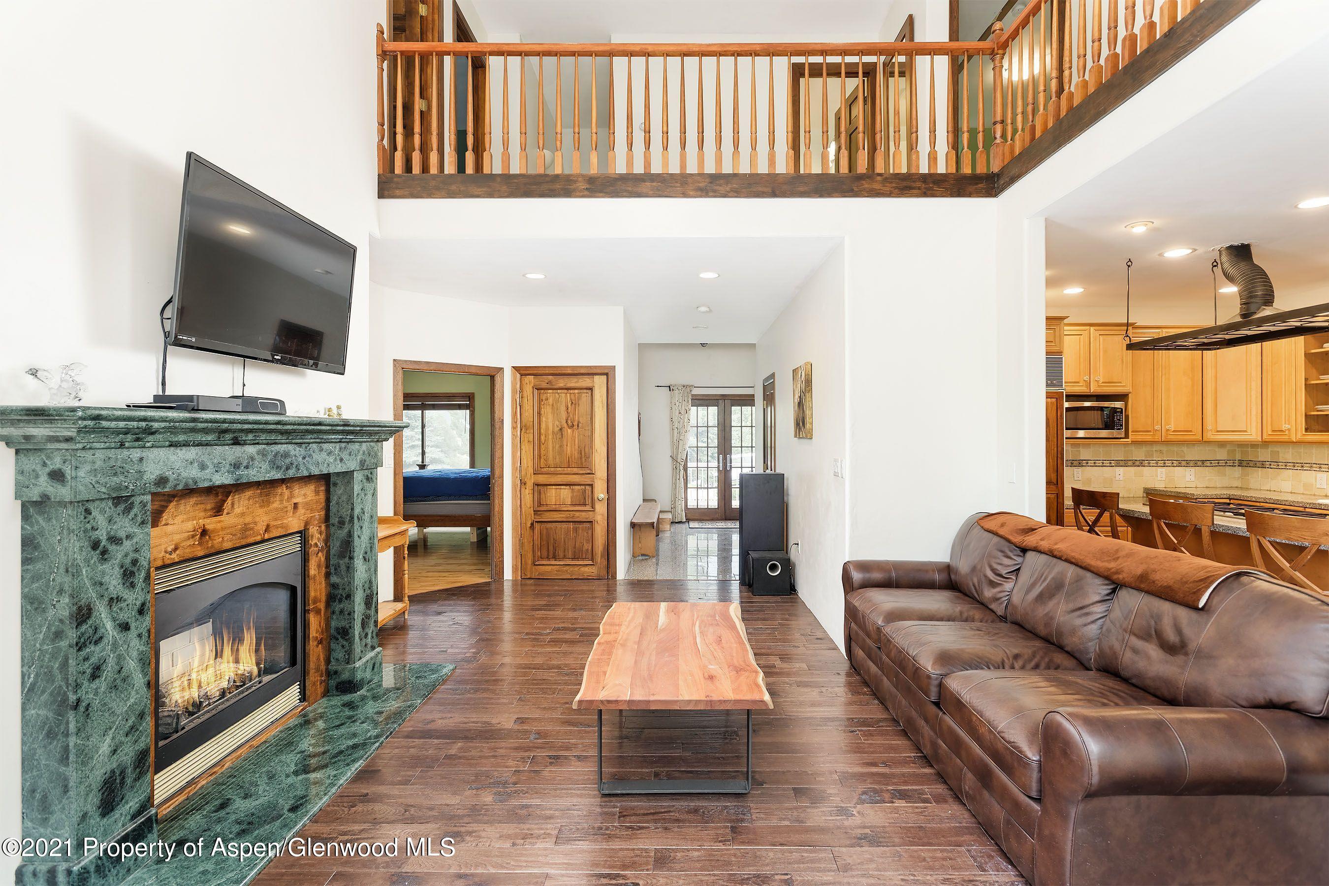 461 Original Road Basalt, CO 81621 - Photo 5 of 23 a living room with fireplace furniture and a flat screen tv
