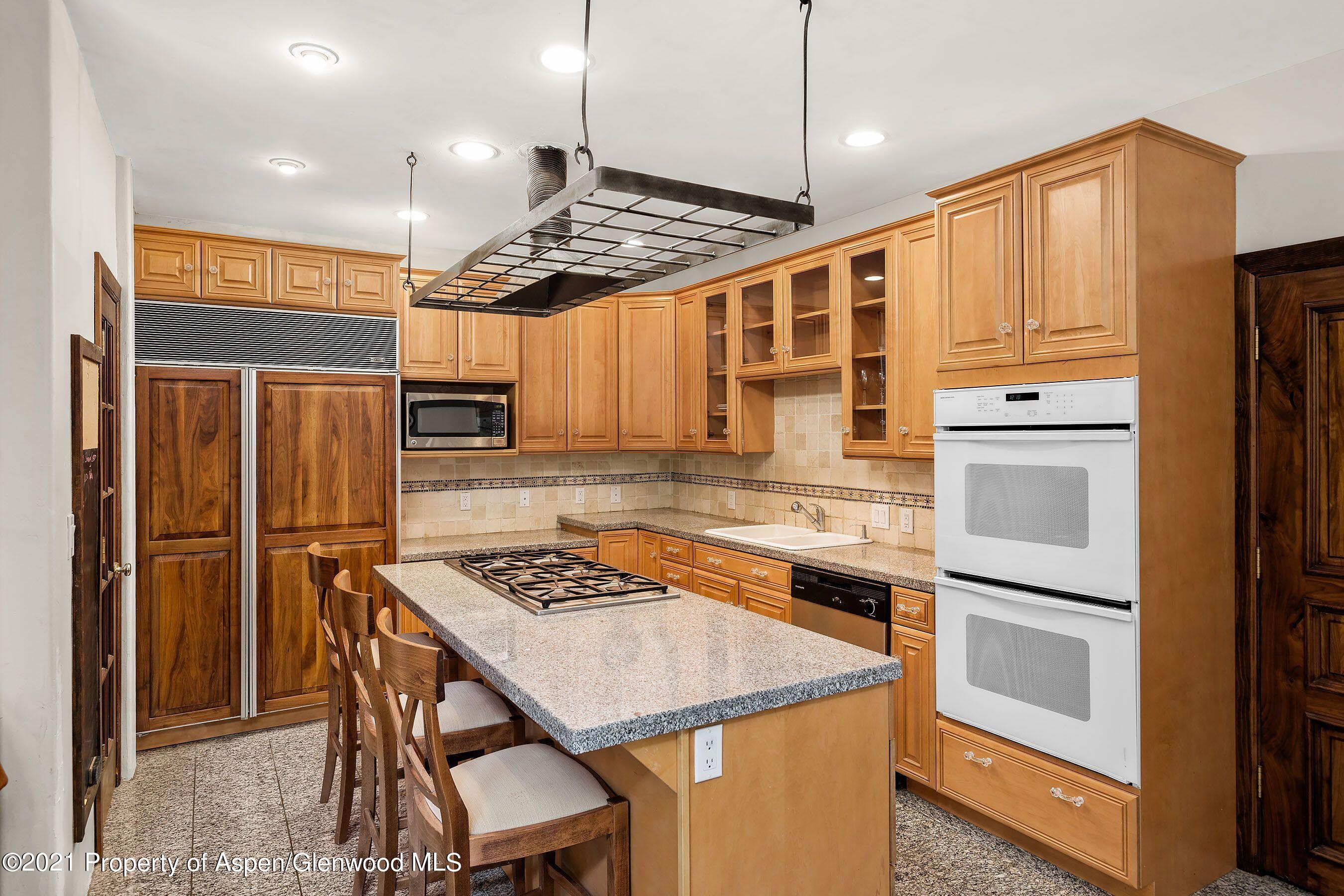 461 Original Road Basalt, CO 81621 - Photo 6 of 23 a kitchen with stainless steel appliances granite countertop a refrigerator a stove and a sink