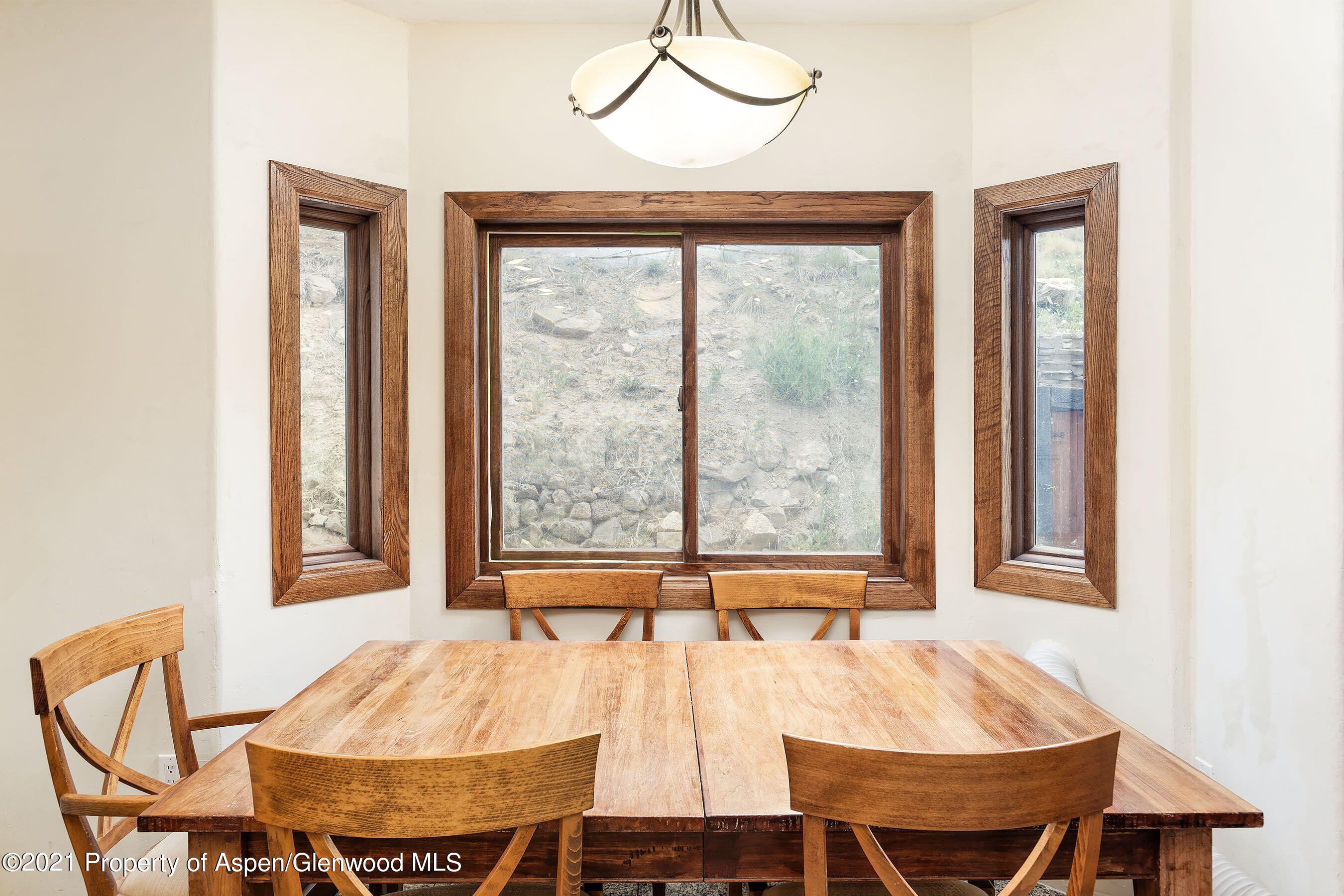461 Original Road Basalt, CO 81621 - Photo 7 of 23 a view of a dining room with furniture and window