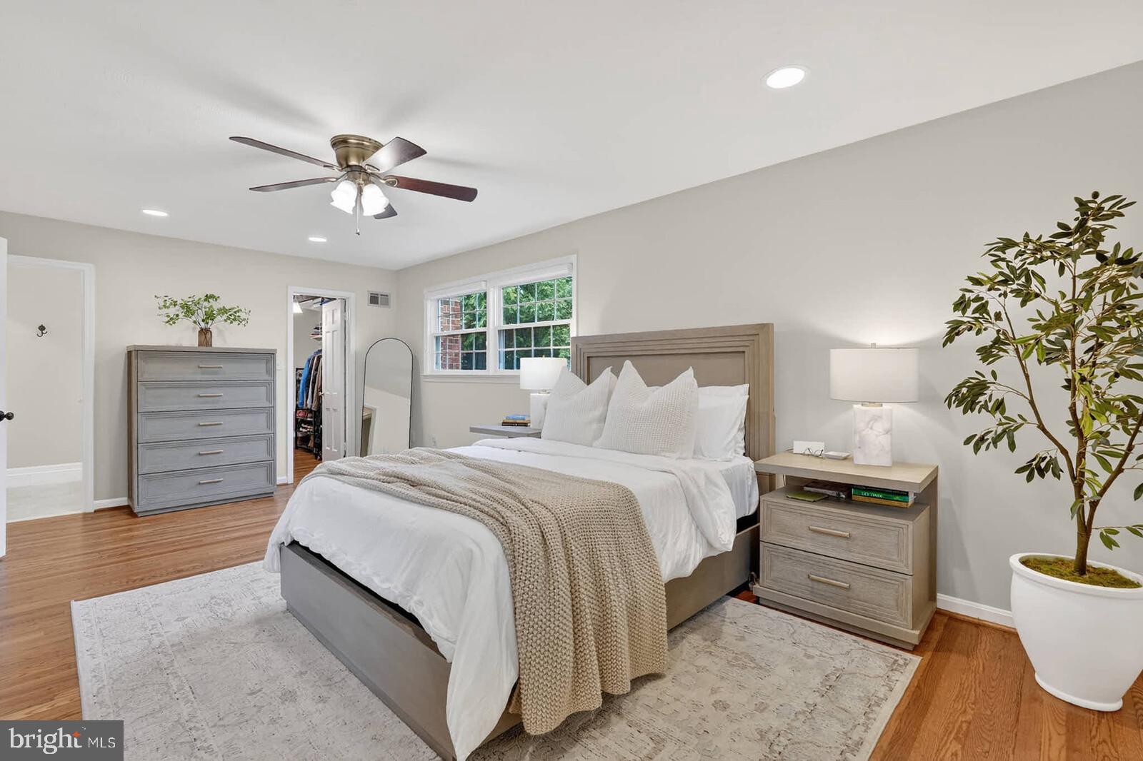 500 Finsbury Road Silver Spring, MD 20904 - Photo 21 of 54 a bedroom with a bed and a chandelier
