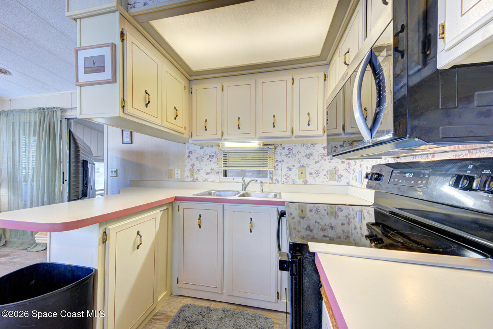 283 Buffalo Place Rockledge, FL 32955 - Photo 16 of 23 a kitchen with stainless steel appliances a sink and cabinets