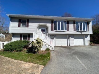 4 Hammerock Road Charlton, MA 01507 - Photo 16 of 39 a front view of a house with garden