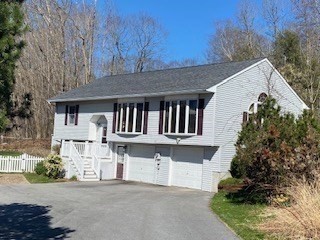 4 Hammerock Road Charlton, MA 01507 - Photo 35 of 39 a front view of a house with a garden
