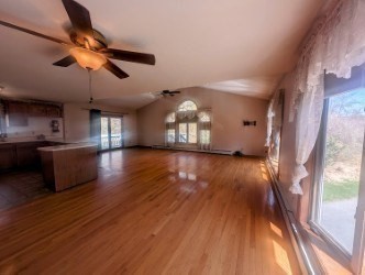 4 Hammerock Road Charlton, MA 01507 - Photo 5 of 39 a view of a room with wooden floor window and a kitchen space