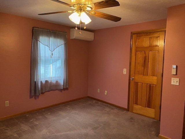 4 Hammerock Road Charlton, MA 01507 - Photo 8 of 39 an empty room with a window and a chandelier fan