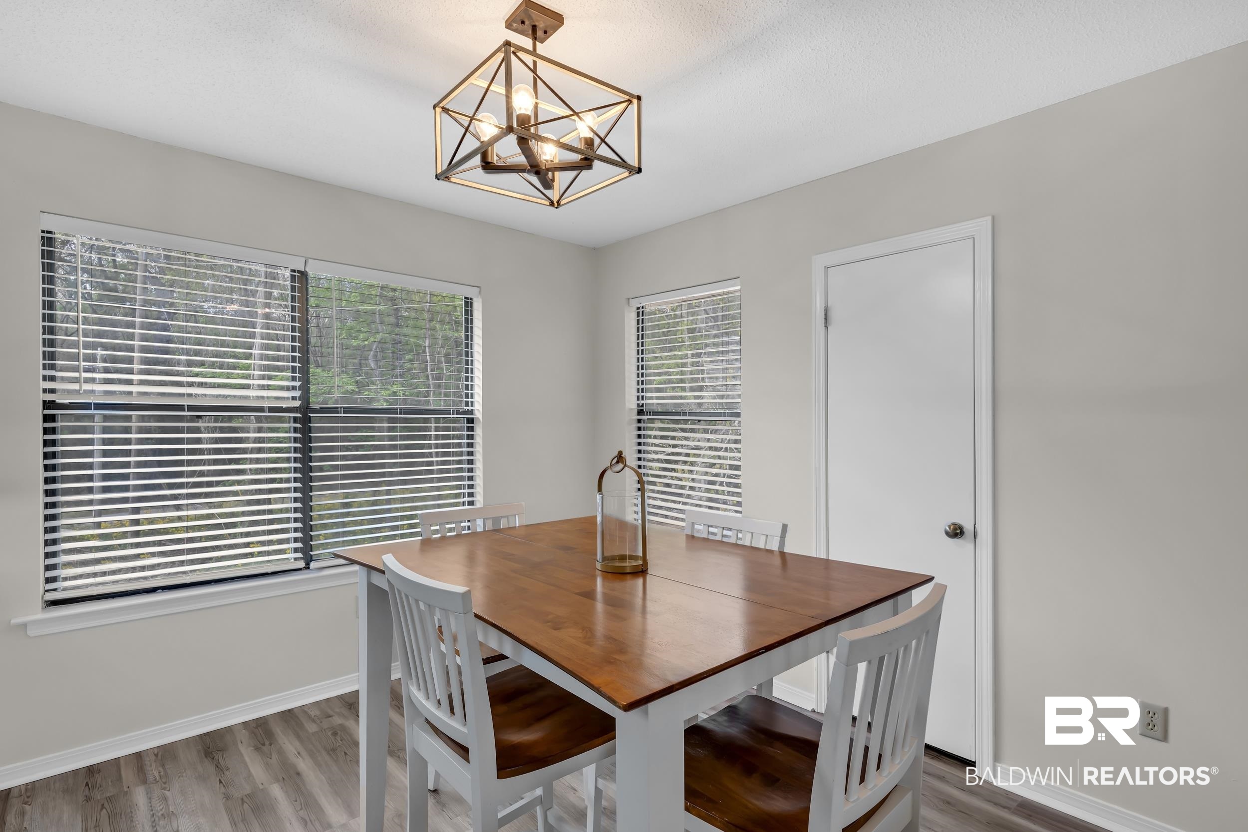 8081 Bryant's Lndg Road Stockton, AL 36579 - Photo 27 of 48 Dining space featuring wood finished floors and hanging lights