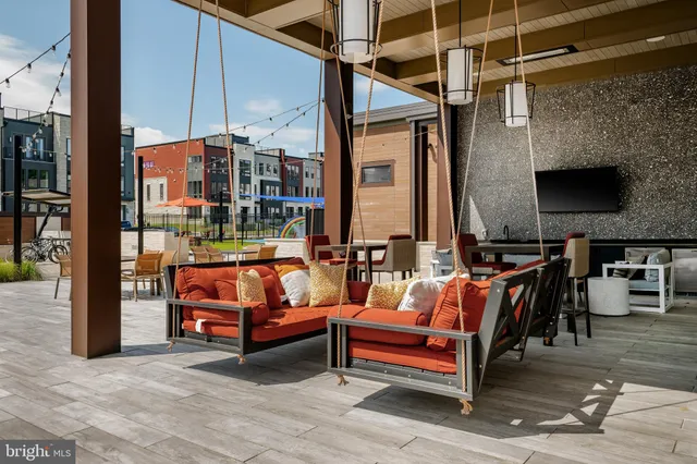 an outdoor living room with furniture