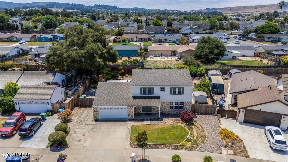 360 Tallyho Road Santa Maria, CA 93455 - Photo 5 of 72 an aerial view of a house with swimming pool and mountain view