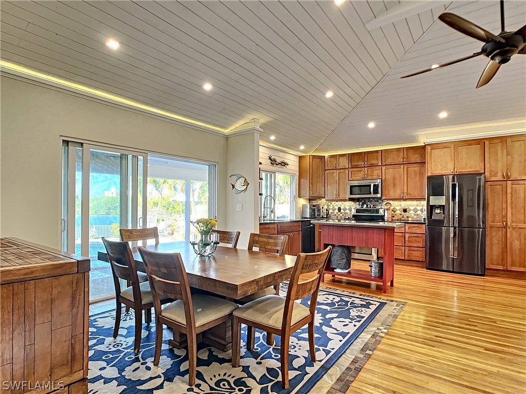 8065 Lagoon Road Fort Myers Beach, FL 33931 - Photo 17 of 28 a view of a dining room with furniture
