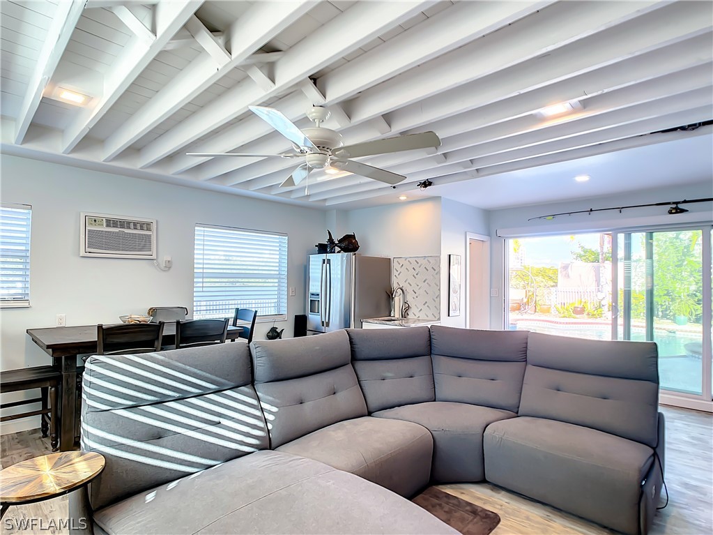 8065 Lagoon Road Fort Myers Beach, FL 33931 - Photo 23 of 28 a living room with furniture and a large window