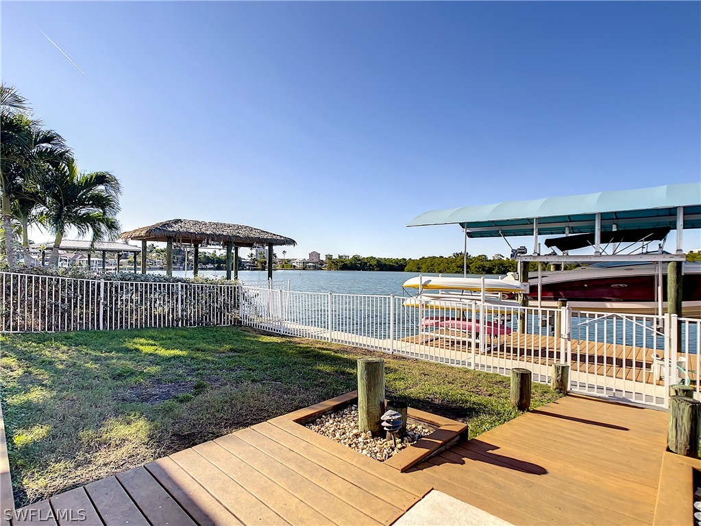 8065 Lagoon Road Fort Myers Beach, FL 33931 - Photo 26 of 28 a view of a chair and table on the wooden floor