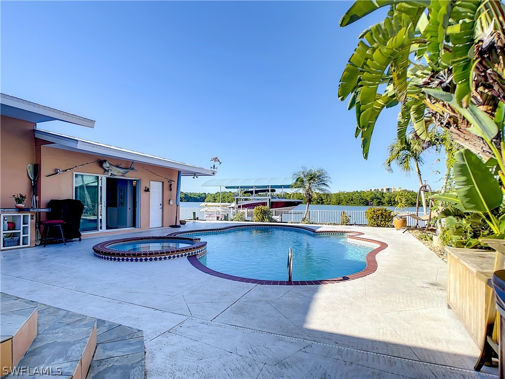 8065 Lagoon Road Fort Myers Beach, FL 33931 - Photo 4 of 28 a outdoor space with swimming pool and furniture