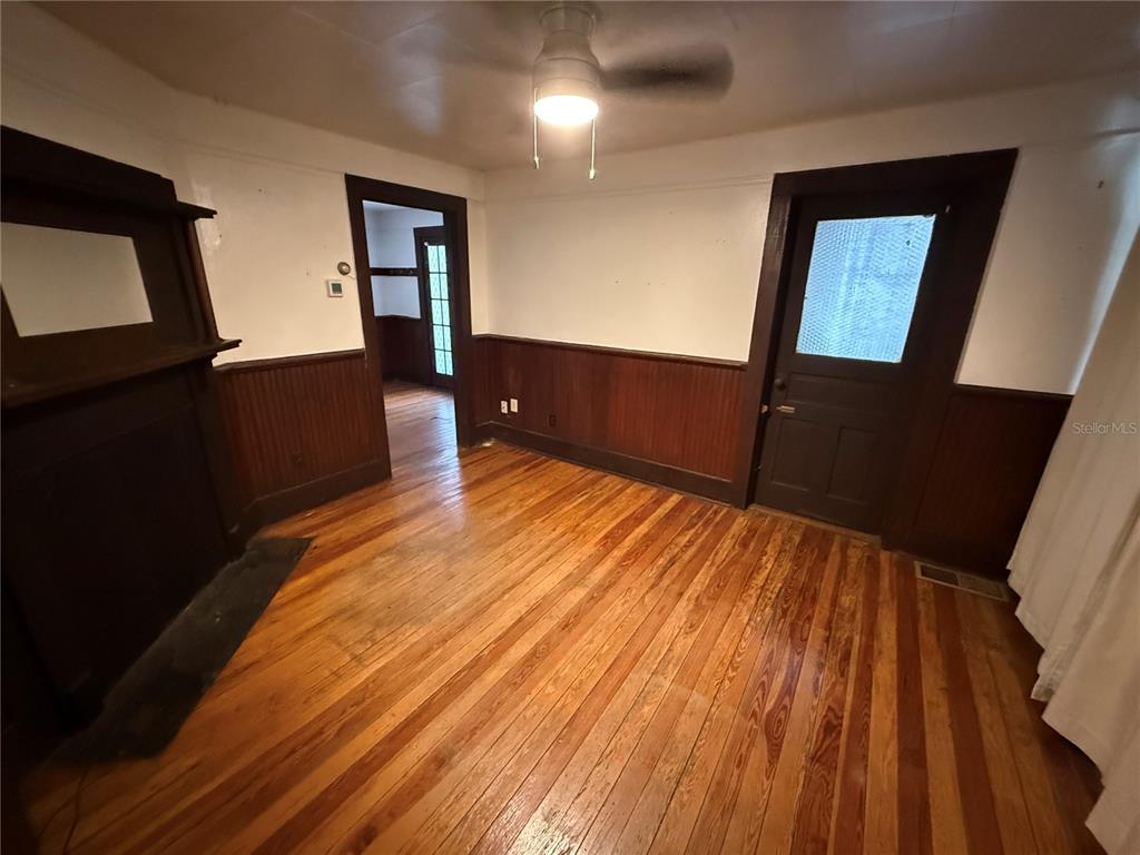2523 Northwest 6th Street, Unit 1 Gainesville, FL 32609 - Photo 2 of 7 a view of a living room with wooden floor