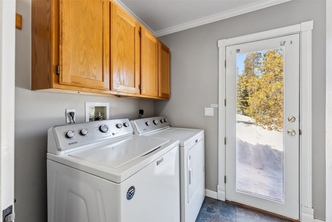 30 Grey Fox Lane Dillon, CO 80435 - Photo 37 of 50 Main level laundry/mud room off of the kitchen with outdoor backyard access and garage access
