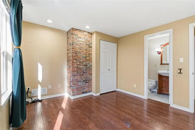 a view of livingroom with hardwood floor and a ceiling fan