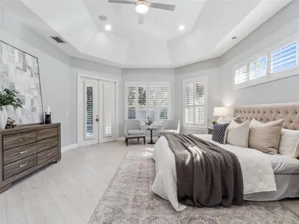 a spacious bedroom with a bed and furniture