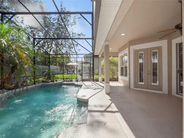 a view of swimming pool with outdoor seating
