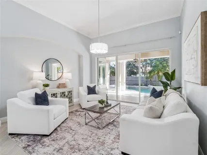 a living room with furniture and a large window
