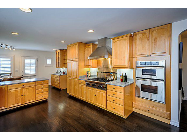 23 Channing Road Burlingame, CA 94010 - Photo 12 of 25 a kitchen with stainless steel appliances granite countertop a stove a sink and a refrigerator