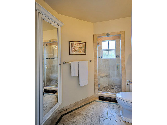 23 Channing Road Burlingame, CA 94010 - Photo 18 of 25 a bathroom with a granite countertop toilet a sink and shower