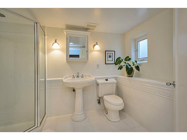 23 Channing Road Burlingame, CA 94010 - Photo 21 of 25 a bathroom with a sink toilet mirror and shower