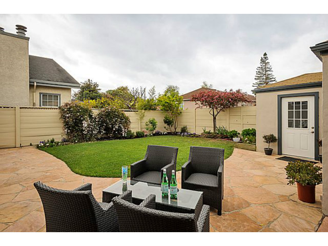23 Channing Road Burlingame, CA 94010 - Photo 23 of 25 a view of a patio with couches chairs potted plants and a yard