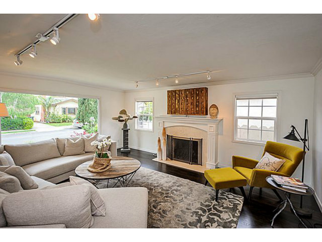 23 Channing Road Burlingame, CA 94010 - Photo 4 of 25 a living room with furniture a fireplace and a large window