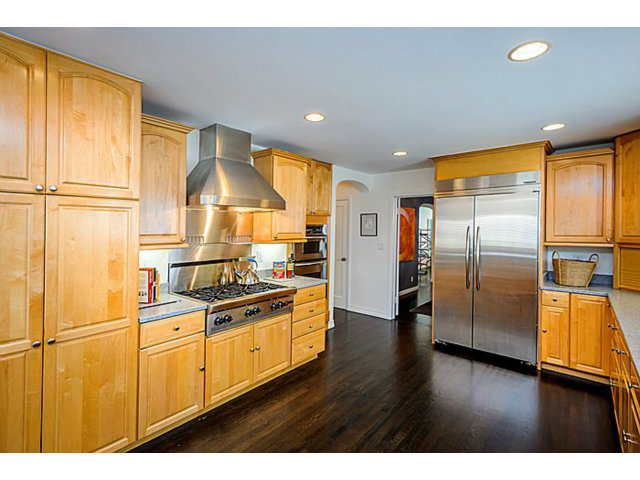 23 Channing Road Burlingame, CA 94010 - Photo 9 of 25 a kitchen with stainless steel appliances granite countertop a refrigerator a sink and white cabinets