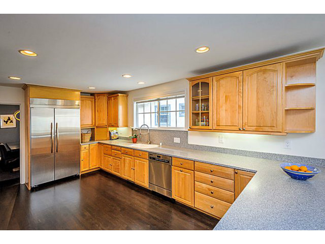 23 Channing Road Burlingame, CA 94010 - Photo 10 of 25 a large kitchen with stainless steel appliances granite countertop a refrigerator a sink dishwasher and wooden cabinets with wooden floor