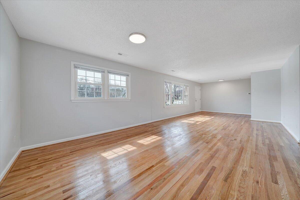 160 Bernard Road Rocky Mount, VA 24151 - Photo 11 of 56 an empty room with wooden floor and windows