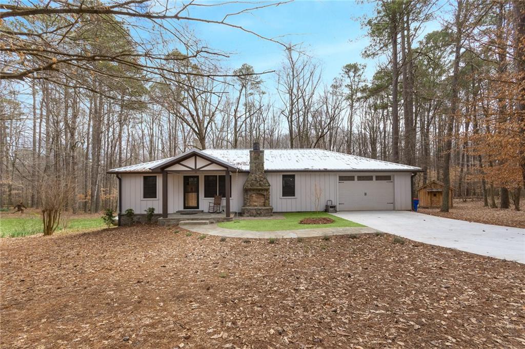 2638 Sugar Pike Road Canton, GA 30115 - Photo 1 of 1 a front view of a house with a yard and trees