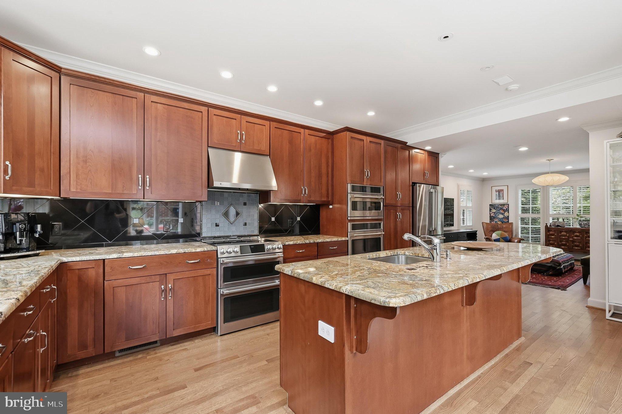 6100 Gloster Road Bethesda, MD 20816 - Photo 17 of 67 Abundant cherry cabinets! Stool counter seating