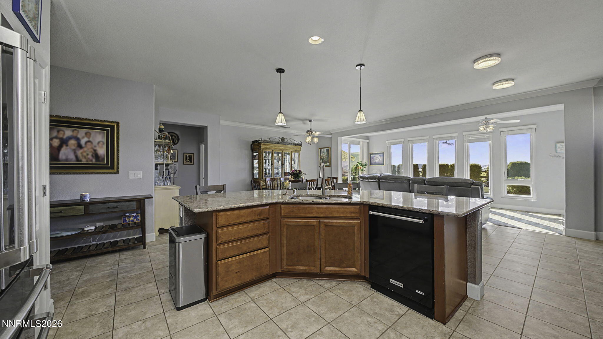 9111 Kenton Trail Reno, NV 89523 - Photo 11 of 49 a kitchen with stainless steel appliances granite countertop a sink and dishwasher