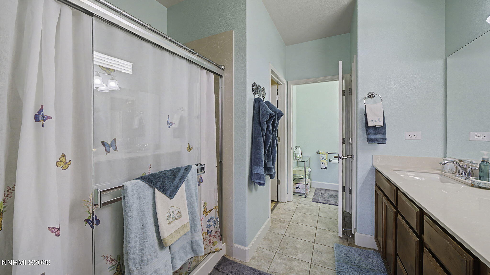 9111 Kenton Trail Reno, NV 89523 - Photo 18 of 49 a bathroom with a double vanity sink and shower