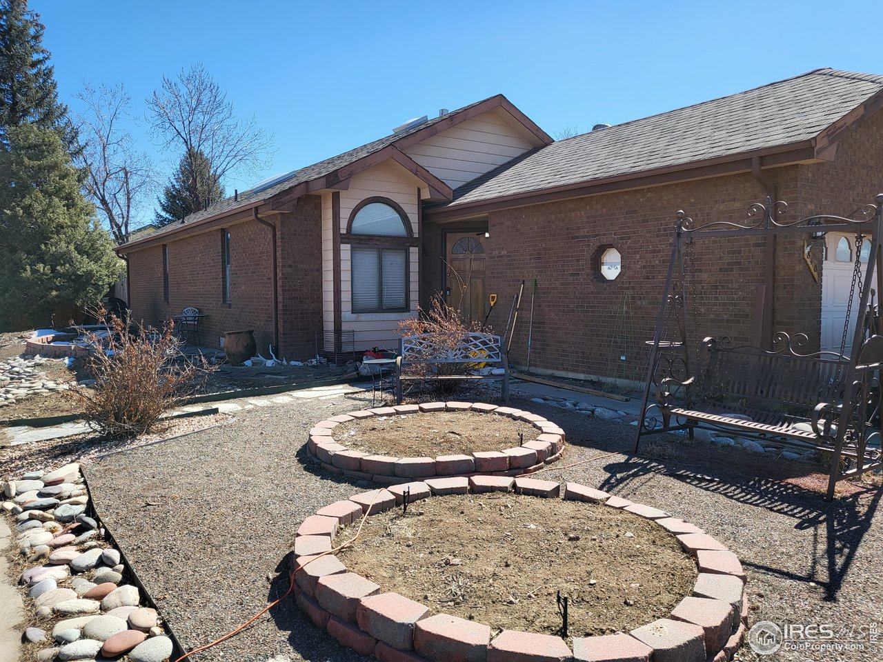840 Wade Road Longmont, CO 80503 - Photo 1 of 9 a backyard of a house with table and chairs