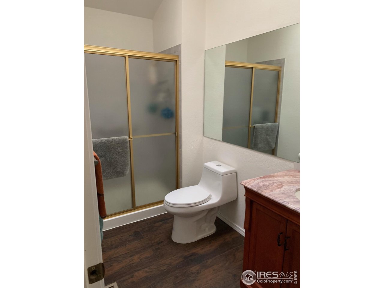 840 Wade Road Longmont, CO 80503 - Photo 5 of 9 a bathroom with a toilet and a sink