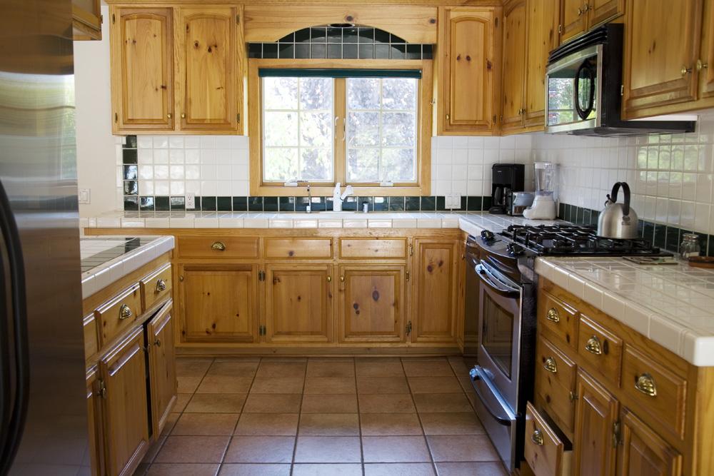 3959 Foothill Road Santa Barbara, CA 93110 - Photo 2 of 4 a kitchen with a sink stove and cabinets