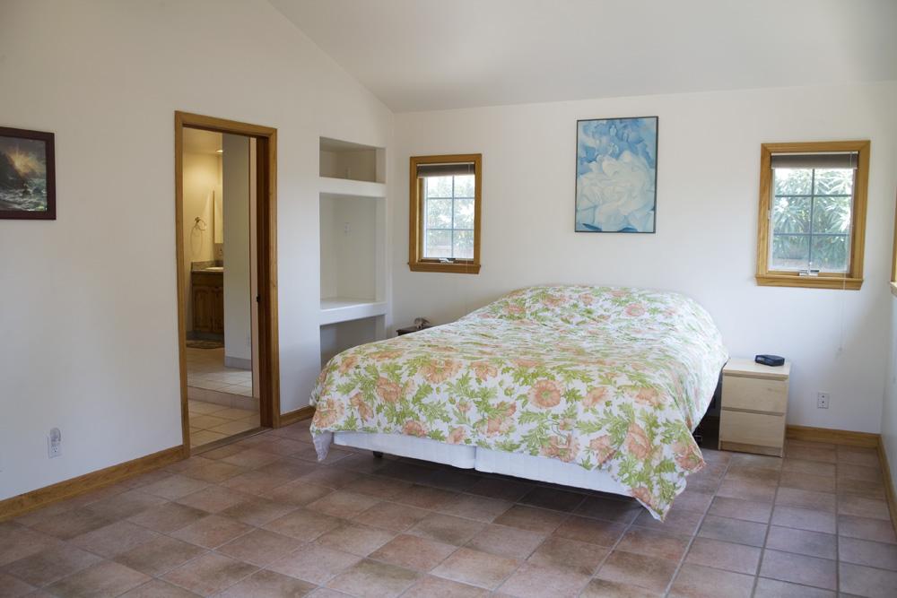 3959 Foothill Road Santa Barbara, CA 93110 - Photo 3 of 4 a bedroom with a bed and painting on the wall