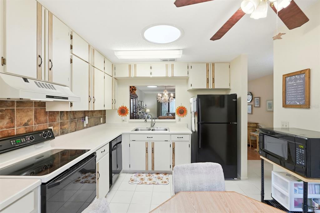 41 Crooked Pine Road Port Orange, FL 32128 - Photo 15 of 40 a kitchen with a sink stainless steel appliances and cabinets