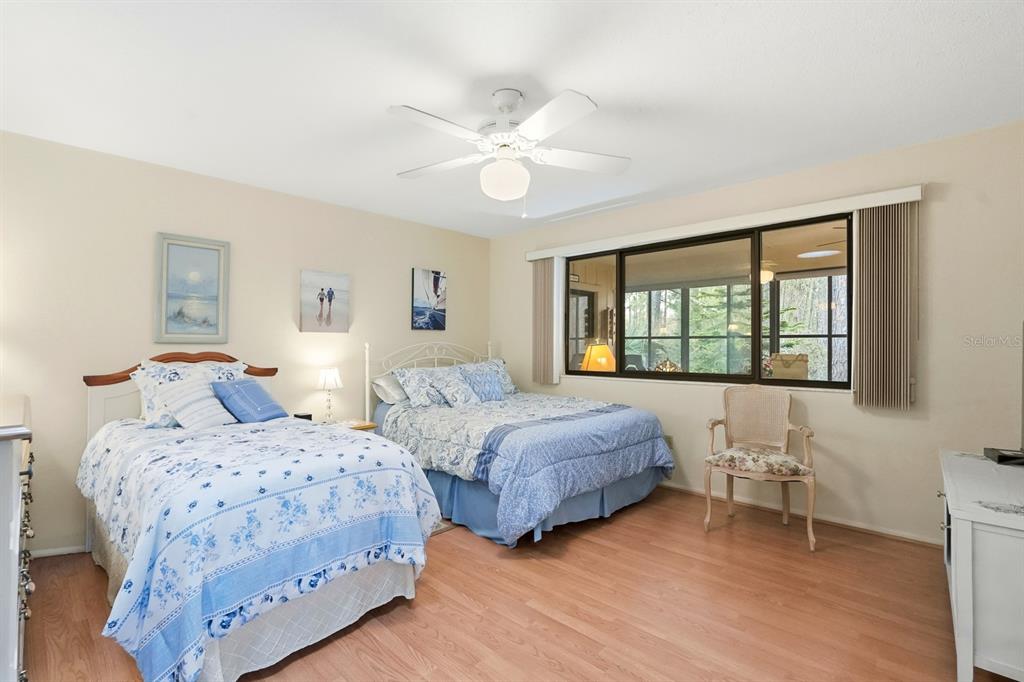 41 Crooked Pine Road Port Orange, FL 32128 - Photo 18 of 40 a bedroom with two beds and a window