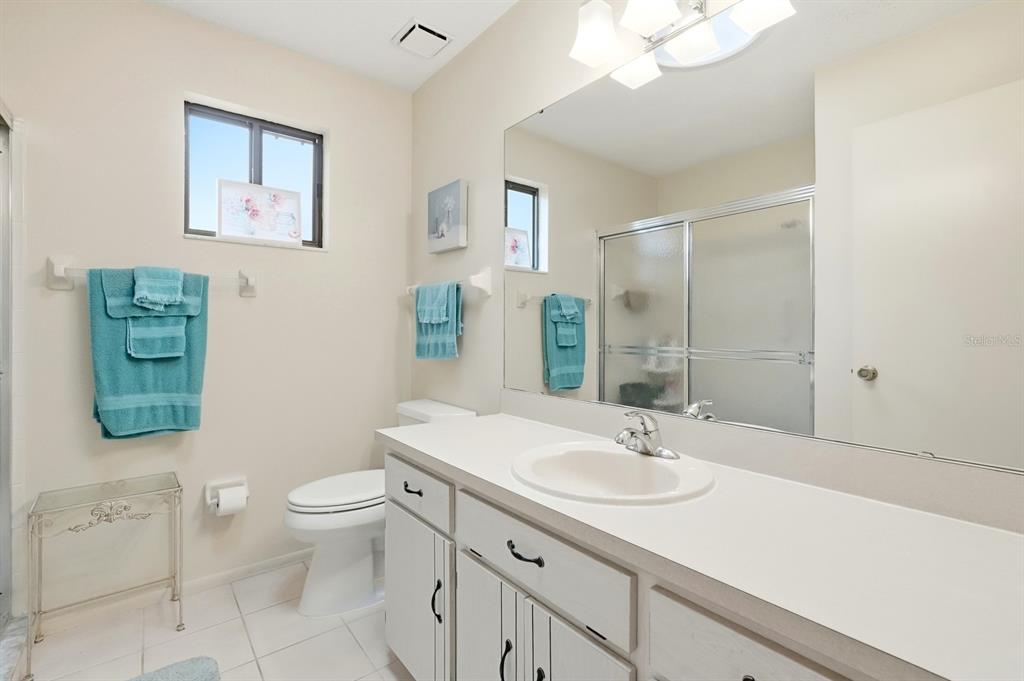 41 Crooked Pine Road Port Orange, FL 32128 - Photo 20 of 40 a bathroom with a sink a toilet and mirror