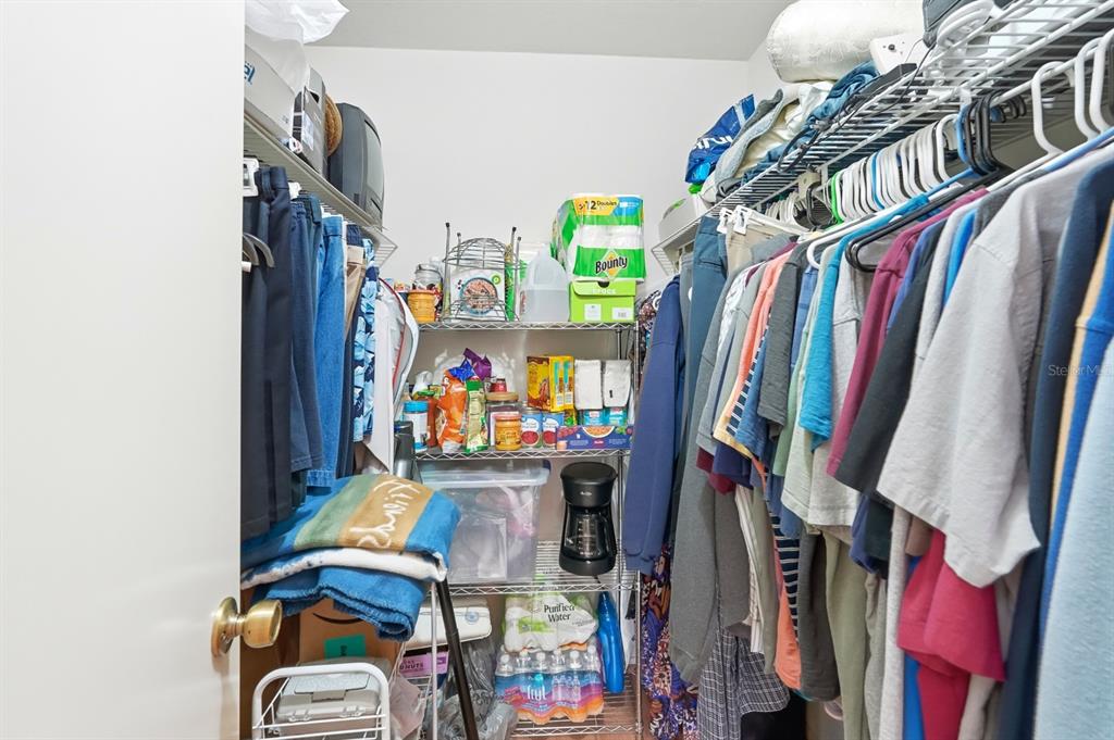 41 Crooked Pine Road Port Orange, FL 32128 - Photo 25 of 40 a view of walk in closet with clothes and shoes