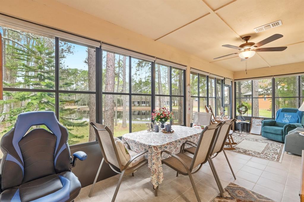 41 Crooked Pine Road Port Orange, FL 32128 - Photo 26 of 40 a view of a dining room with furniture window and outside view