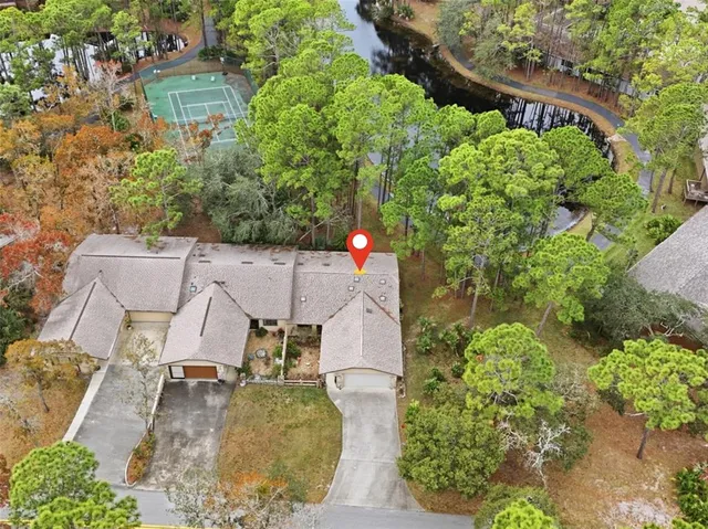 an aerial view of a house with a garden