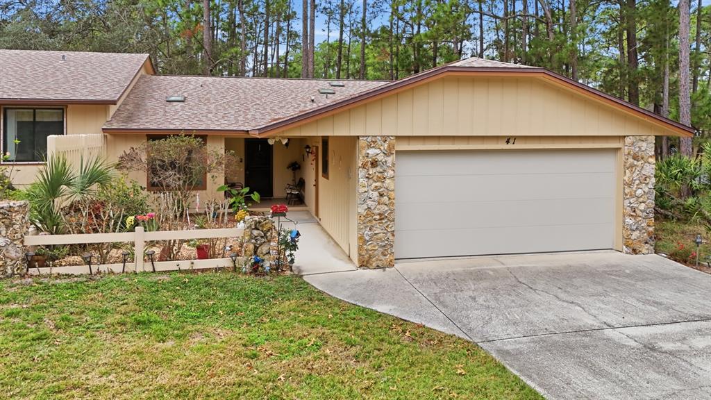 41 Crooked Pine Road Port Orange, FL 32128 - Photo 40 of 40 a view of a house with a yard plants and large tree